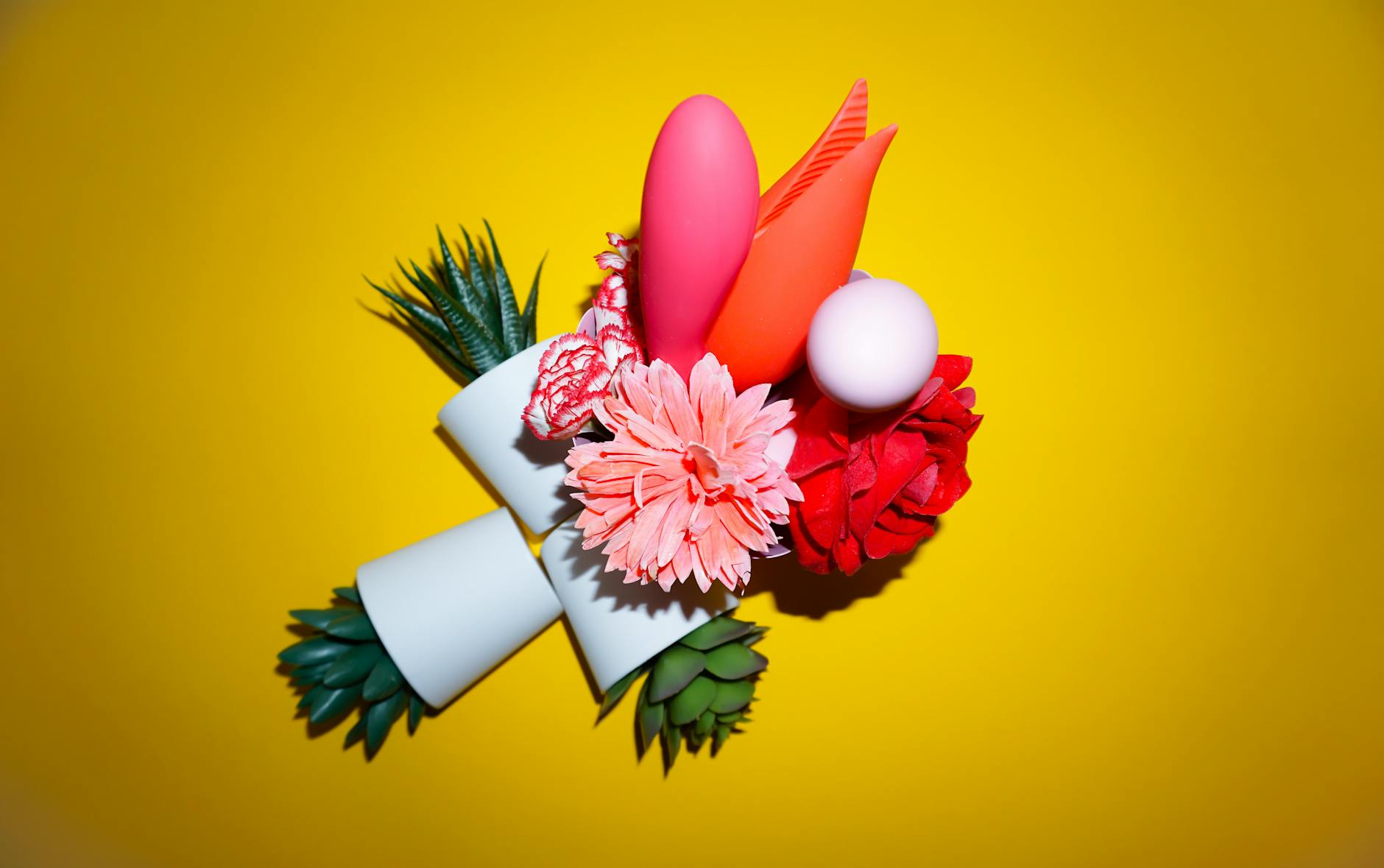 Ripe vivid lemons on a bright yellow background, representing lemon vibrators and fresh pleasure after menopause